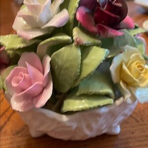 Charming Ceramic Floral Display with Pink, Yellow, and Green Blooms